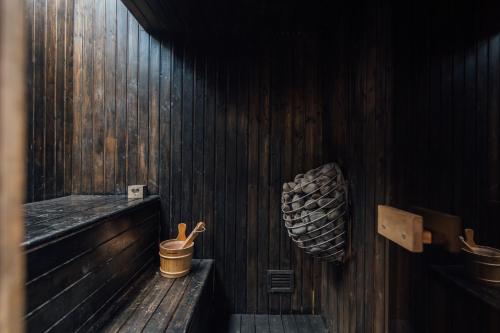 a wooden room with wooden utensils on a wall at Stylish 2 Bedroom Flat with a Private Sauna in Finchley