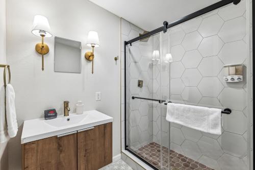a bathroom with a shower with a sink and a toilet at Phoenix Mountain Retreat in Phoenix