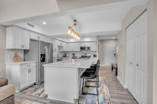 a kitchen with white cabinets and a white counter top at Family townhouse with Fireplace in Ellicottville