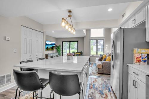 a kitchen and living room with a table and chairs at Family townhouse with Fireplace in Ellicottville