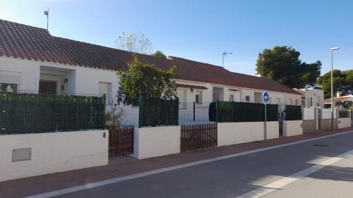 a row of white houses on a street at Casa Uly 2 in Riumar
