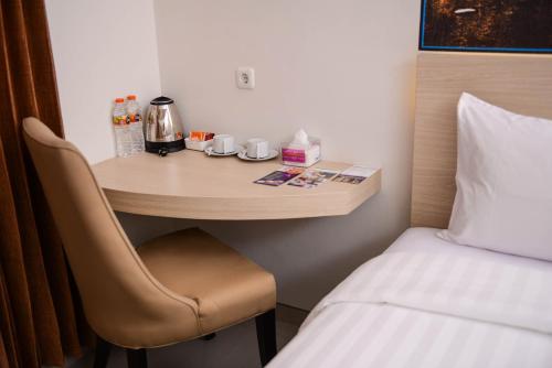 Postel nebo postele na pokoji v ubytování Midtown Xpress Sampit - Kalimantan Tengah