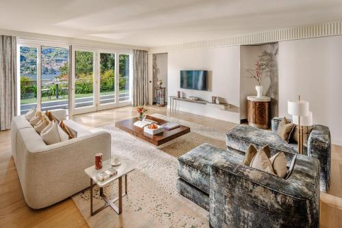 a living room with a couch and a table at Mandarin Oriental, Lago di Como in Blevio