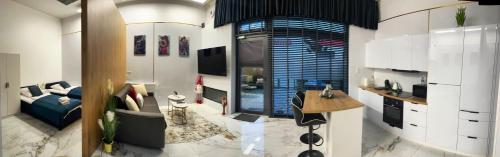 a living room with a couch and a table at LUMAX Studio in Gryfice