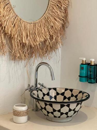 a bathroom counter with a sink and a mirror at Herdade d'Amoreira Jasmin Villa in Aljezur