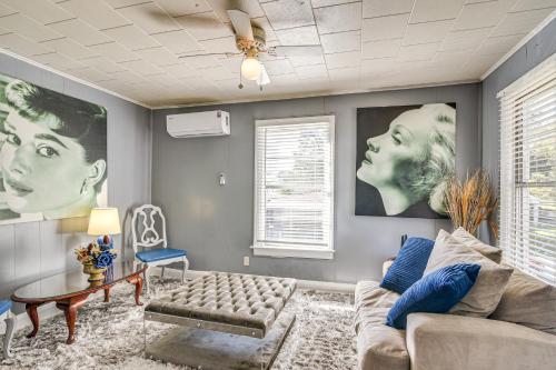 a living room with a couch and a table at Near Sabine Lake Pet-Friendly Apt in Port Arthur in Port Arthur