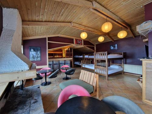 a restaurant with tables and chairs in a room at Panorama in Gudauri