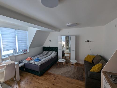a living room with a bed and a couch at Kod Strica in Kopaonik