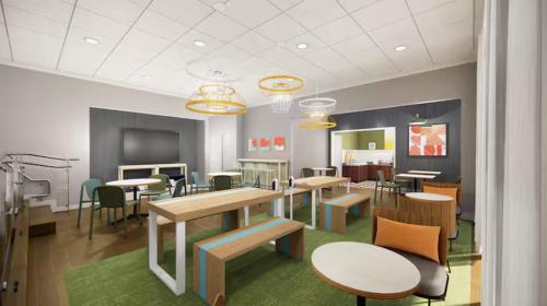 a classroom with tables and chairs in a room at Spark by Hilton Tumwater in Tumwater