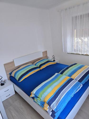 Postel nebo postele na pokoji v ubytování Apartmaji PRI JUNESKO