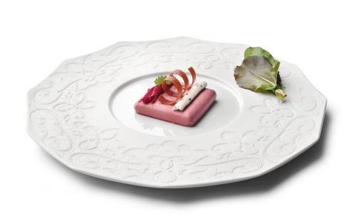 a white plate with a pink dessert on it at Villa Petriolo - Small Luxury Hotels of the World in Cerreto Guidi
