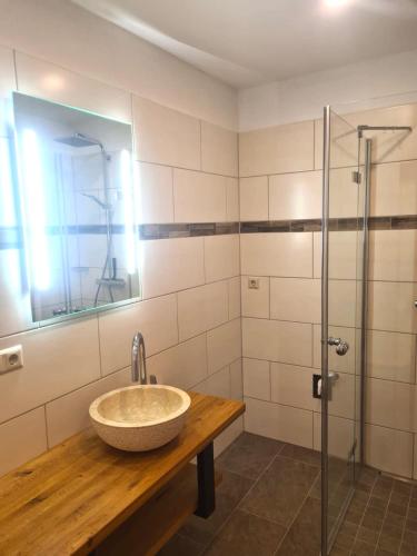 a bathroom with a sink and a shower at Zlattinger in Trebesing