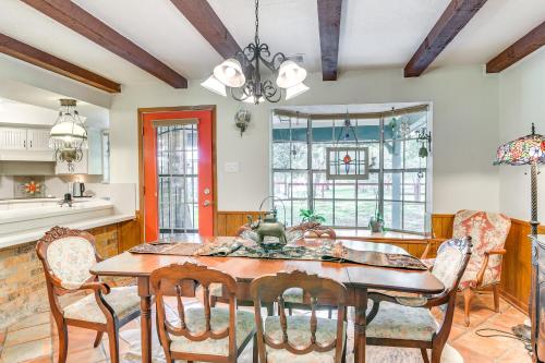 a kitchen and dining room with a table and chairs at Family Home on 30 Acres in Manvel! in Manvel