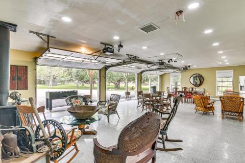 a room with a bunch of chairs and tables at Family Home on 30 Acres in Manvel! in Manvel