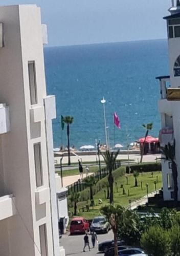 a view of the ocean from a building at Appartement complexe Costa Mar avec piscine privée très sécurisé 3min de la plage Luxe et détente in Martil