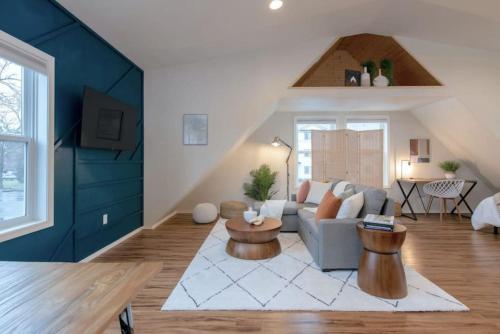 a living room with a couch and a table at U-District Loft near GU w Self Check-in and Wifi in Spokane