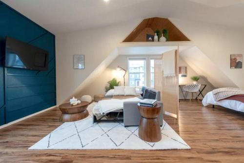 a bedroom with a bed and a desk in a room at U-District Loft near GU w Self Check-in and Wifi in Spokane