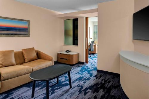 a living room with a couch and a table at Fairfield Inn & Suites by Marriott Virginia Beach Oceanfront in Virginia Beach