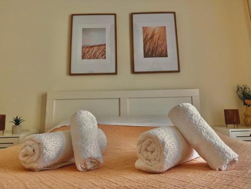 a bedroom with two towels on a bed at Alexandra's station-Piraeus's Centre,Beside Metro in Piraeus