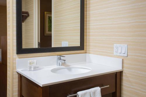 a bathroom with a sink and a mirror at Fairfield Inn Manchester - Boston Regional Airport in Manchester