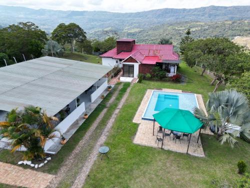 an aerial view of a house with a swimming pool at New San Nicolas in Moniquirá