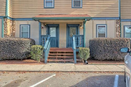 a house with a door and stairs in front of it at Downtown Helen Walk To Shops And Restaurants in Helen