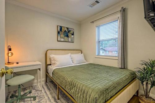 a bedroom with a bed and a desk and a window at Downtown Helen Walk To Shops And Restaurants in Helen