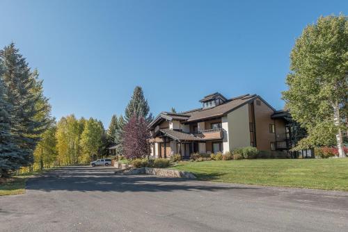 a large house with a driveway in front of it at Wildflower Condo 671 in Sun Valley