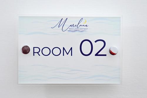 a sign for room with hazelnuts at B&B MareLuna in Angri