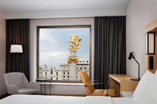 a hotel room with a view of the palace ofminster at Courtyard by Marriott Tbilisi in Tbilisi City