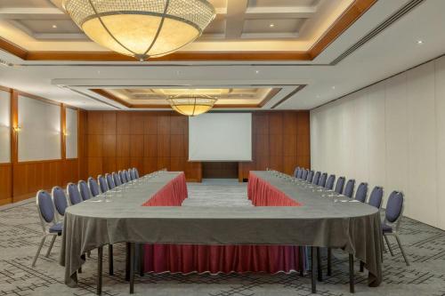 a large conference room with a long table and chairs at Courtyard by Marriott Tbilisi in Tbilisi City