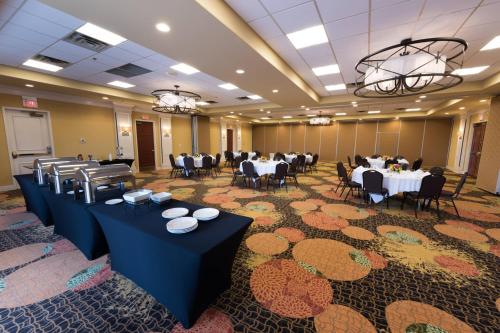 a banquet hall with tables and chairs in a room at Courtyard Page at Lake Powell in Page