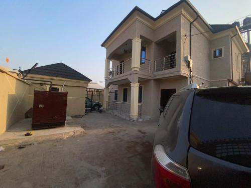 a car parked in front of a house at Your Elegant Home in Lagos