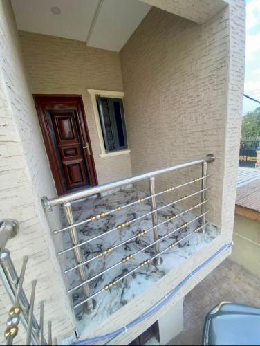 a metal railing on the side of a house at Your Elegant Home in Lagos