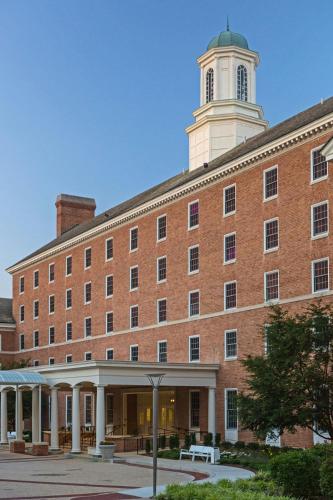 a large brick building with a tower on top of it at College Park Marriott Hotel & Conference Center in College Park
