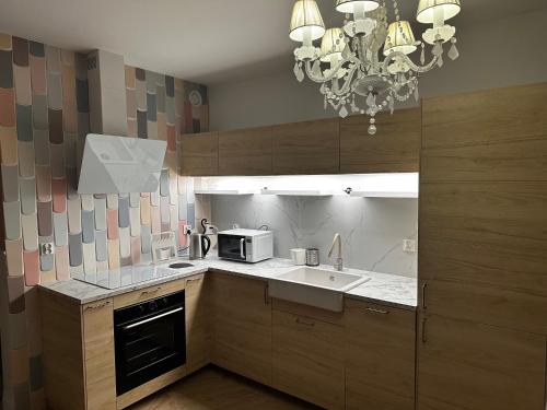 Kuchyň nebo kuchyňský kout v ubytování Apartament na Wzgórzu Piaskowy