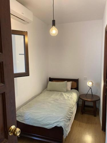 Habitación individual tranquila con baño privado en piso compartido