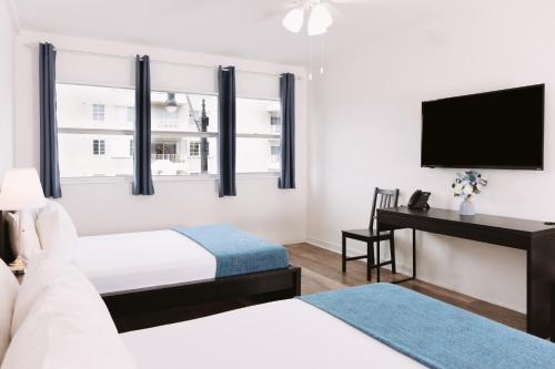 Ένα ή περισσότερα κρεβάτια σε δωμάτιο στο Lorraine Hotel