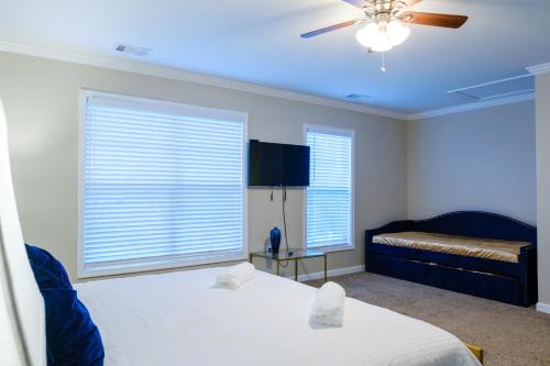 a bedroom with two beds and a ceiling fan at Amazing ATL downtown houses - minutes walk to bars, food and transport! in Atlanta