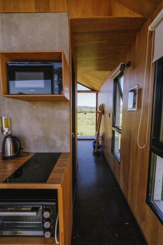 an interior view of a kitchen in an rv at Villa Pancha del Lunarejo in Sierra de Lunarejo