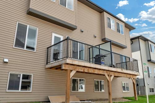 a house with a deck on the side of it at Luxury family vacation rental in Laurel Edmonton in Edmonton