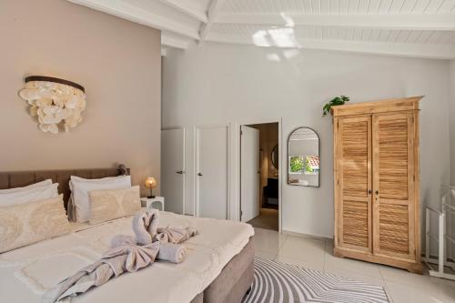Postel nebo postele na pokoji v ubytování Villa Noni Curaçao met jacuzzi