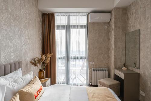 Ένα ή περισσότερα κρεβάτια σε δωμάτιο στο Apartment KeyGo #0109 near Yerevan Fortress