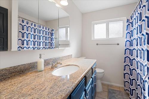 a bathroom with a sink and a toilet at Basketball Court & Heated Pool, 1 Mi To Old Town! in Scottsdale