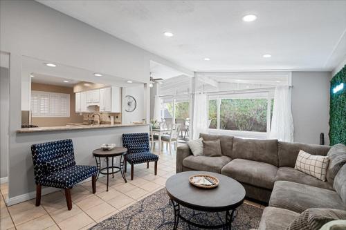 a living room with a couch and a table at Basketball Court & Heated Pool, 1 Mi To Old Town! in Scottsdale