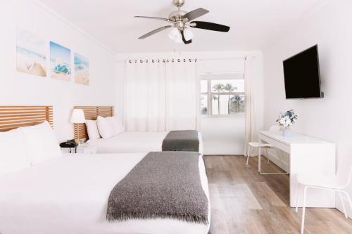 Ένα ή περισσότερα κρεβάτια σε δωμάτιο στο Lorraine Hotel