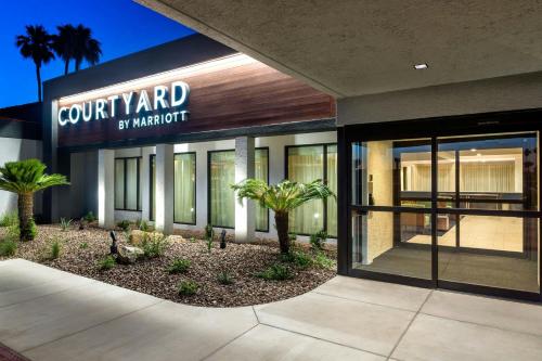 a building with a sign that reads court yard by marriott at Courtyard by Marriott Phoenix North in Phoenix