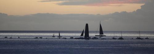 a group of sailboats on the beach at sunset at KazaChatGwadloop in Vieux-Habitants
