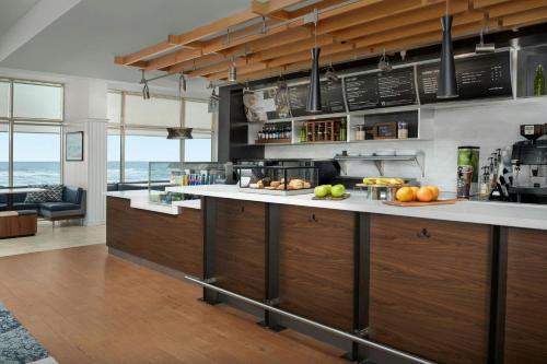 a kitchen with a counter with fruit on it at Courtyard Virginia Beach Oceanfront / North 37th Street in Virginia Beach