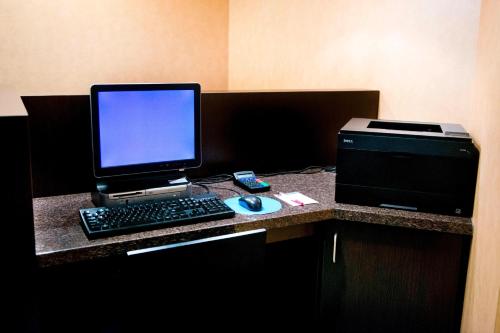 a desk with a laptop computer and a printer at Residence Inn by Marriott Toronto Vaughan in Vaughan